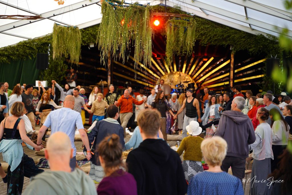 Friends dancing together and enjoying the flow of Butiba Festival