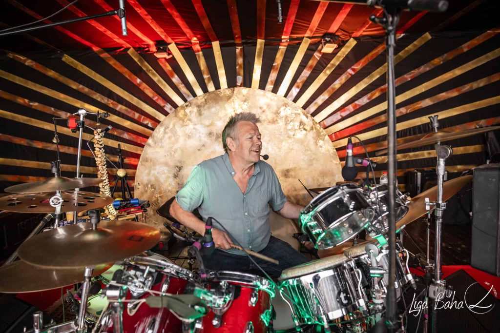 Rishi leading morning dance with live music at festival butiba