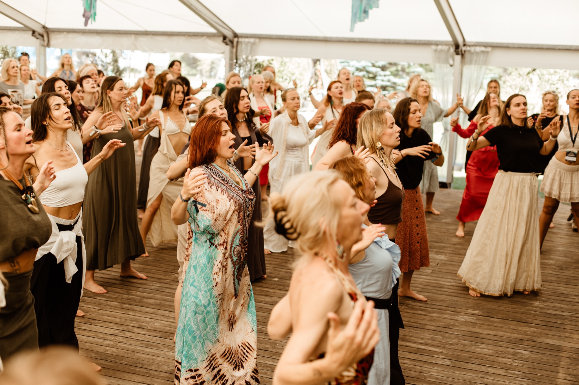 Festival participants singing, dancing and expressing themselves together during a group workshop with Premal Madina at BŪTĪBA Festival 2026