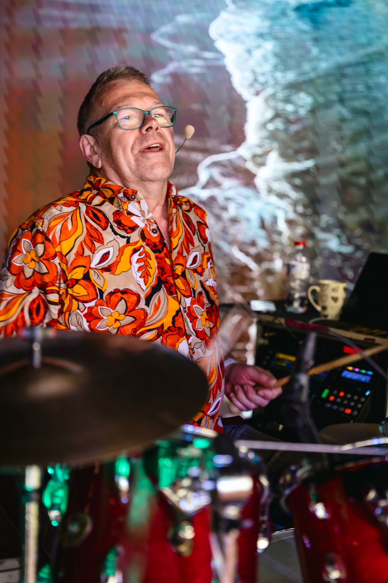 Rishi performing live on drums during the Tribe’s Morning Dance at BUTIBA Festival 2026, bringing rhythm and vibrant energy to the morning gathering.