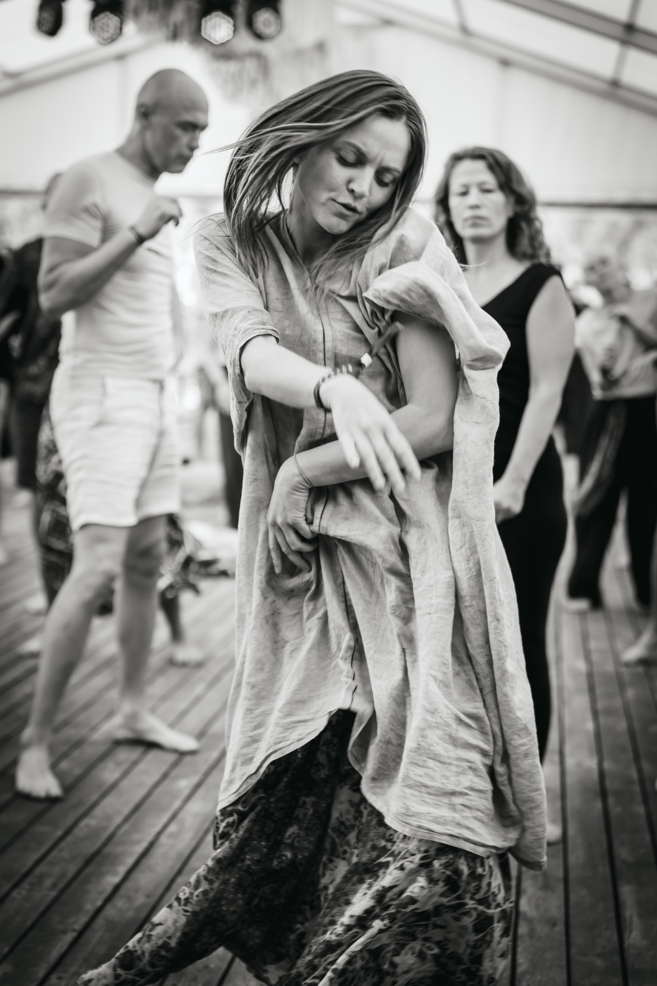 Woman expressing herself through free movement and dance during a BŪTĪBA Festival 2026 workshop