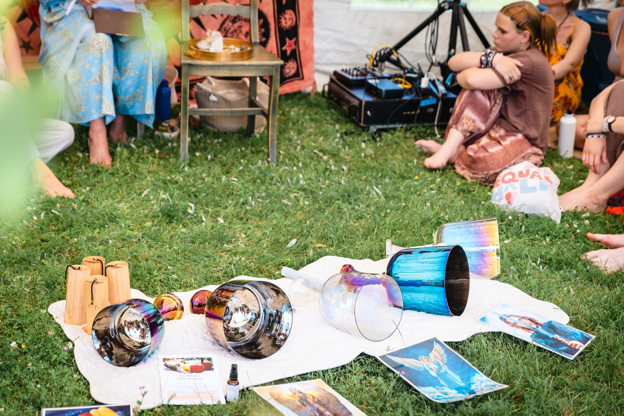 Sound healing instruments, including crystal singing bowls and wooden percussion, arranged for a workshop at BŪTĪBA Festival 2026