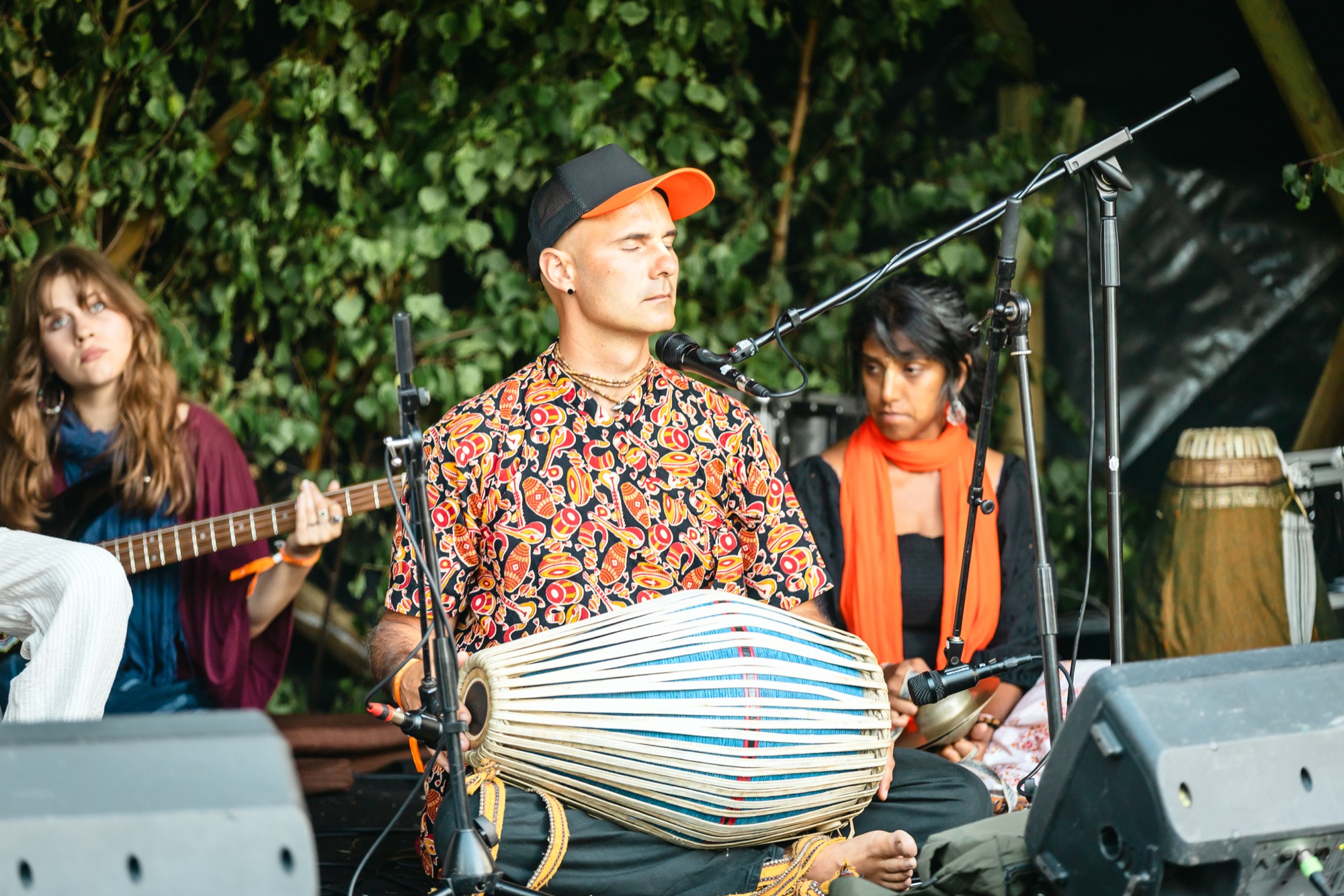 Musicians performing live kirtan at BUTIBA Festival 2026, playing traditional instruments and creating a joyful atmosphere of devotional music and community