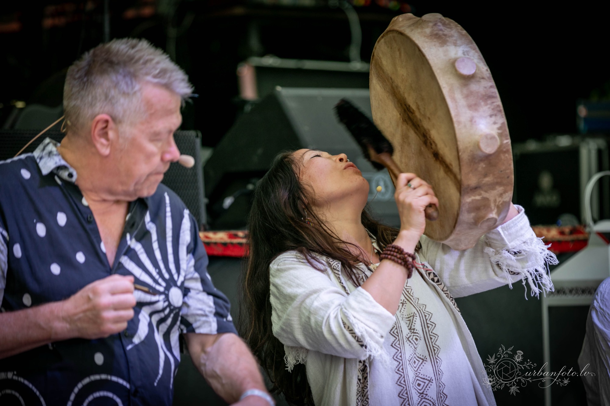 Premal Madina and Rishi performing a ceremonial drum ritual alongside a musician at BŪTĪBA Festival 2026