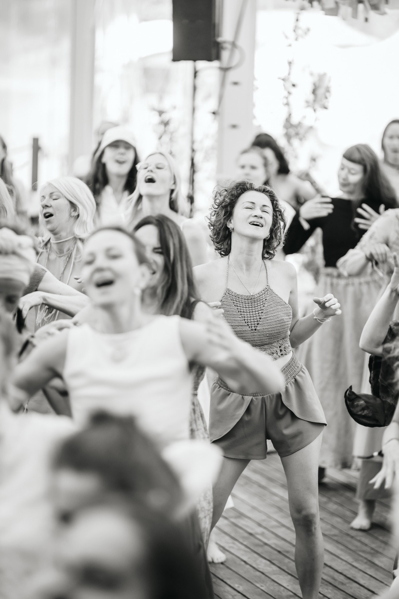 Joyful festival-goers dancing freely together at BUTIBA Festival 2026, expressing connection and the shared energy of the music