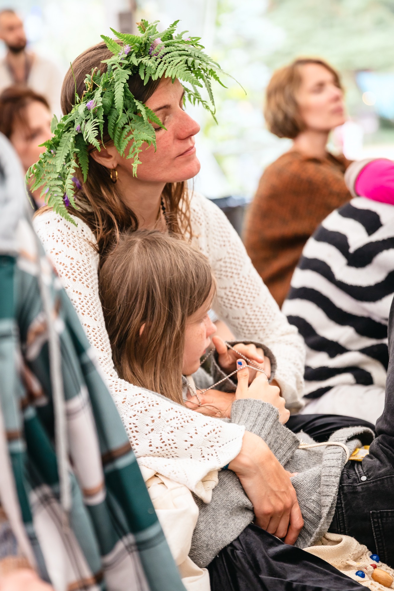 A child playing during a family workshop at BŪTĪBA Festival 2026, celebrating the summer solstice and Latvian Jāņi and Līgo traditions.