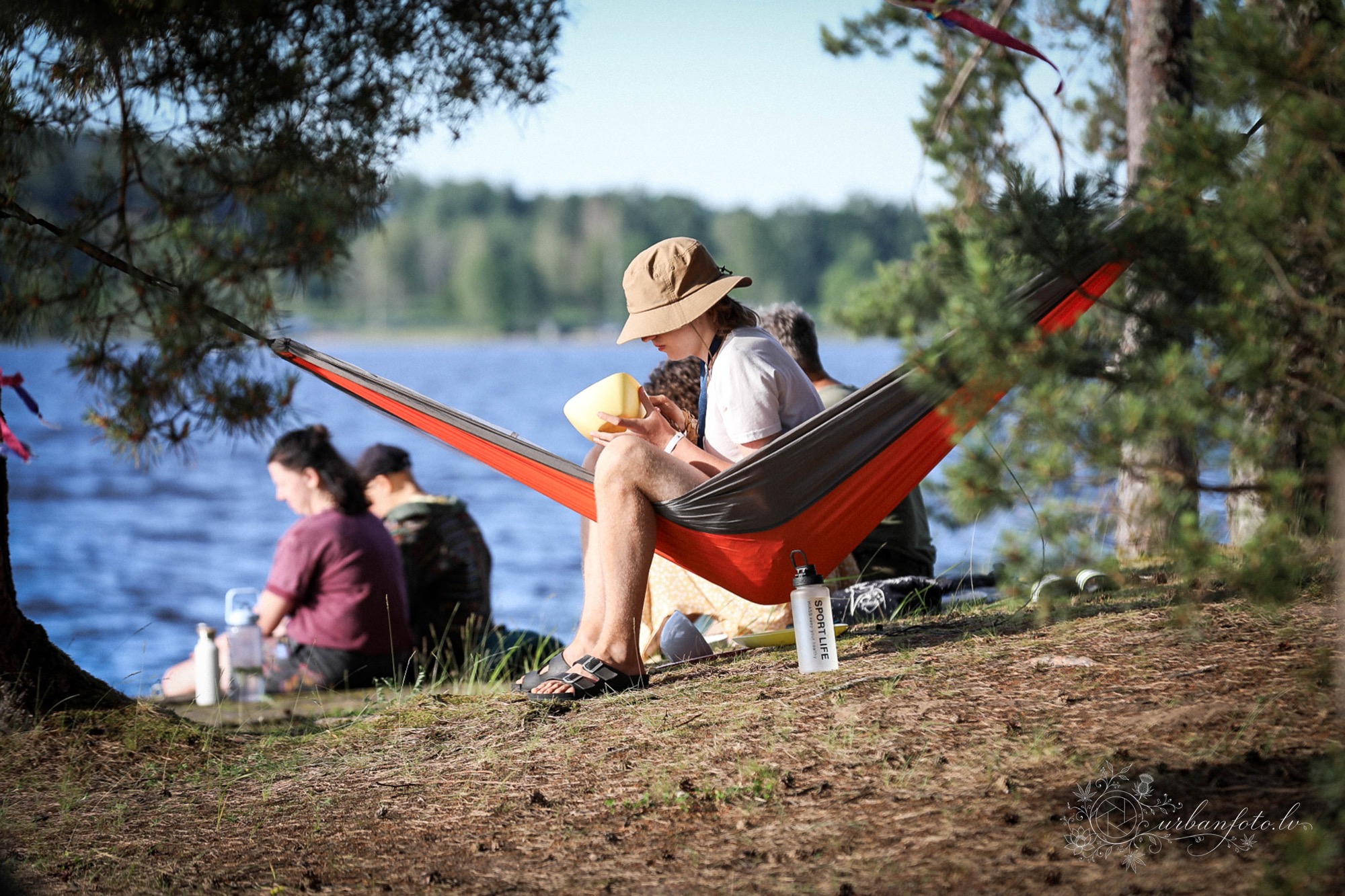 Festival-goers relaxing in hammocks by the water at BUTIBA Festival 2026