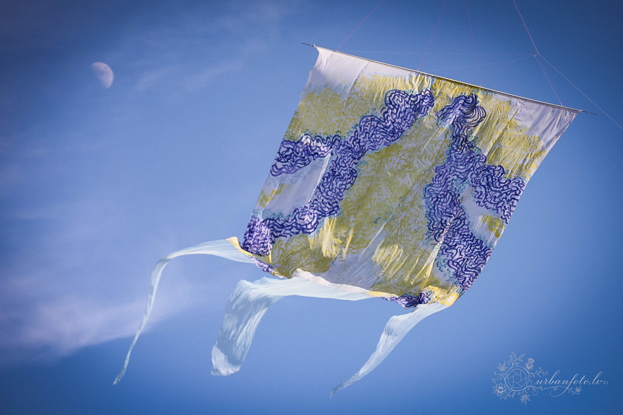 Kite flying against the blue sky at BŪTĪBA Festival 2026