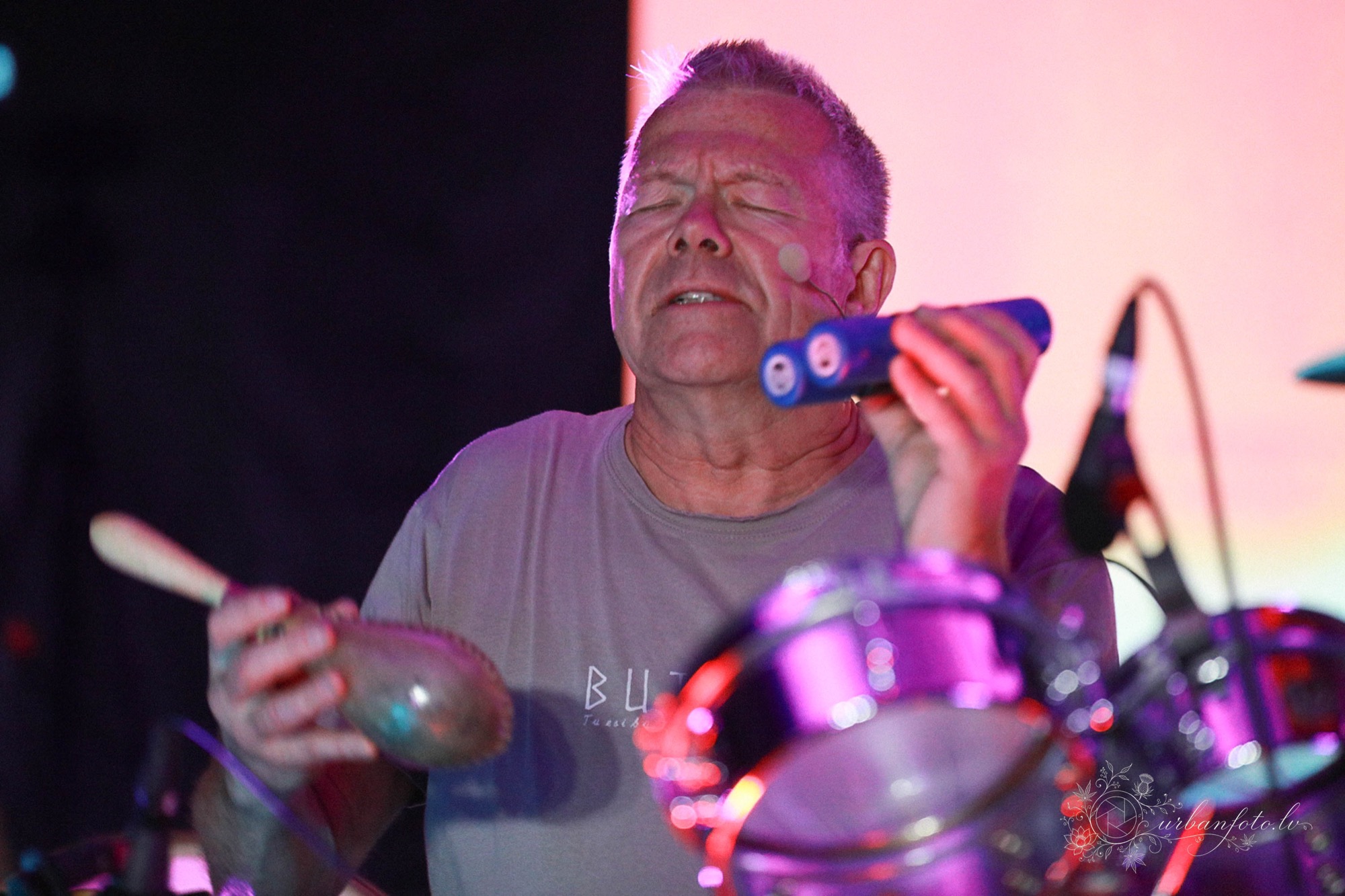 Rishi using shakers at live percussion during a trance dance event at BŪTĪBA Festival 2026