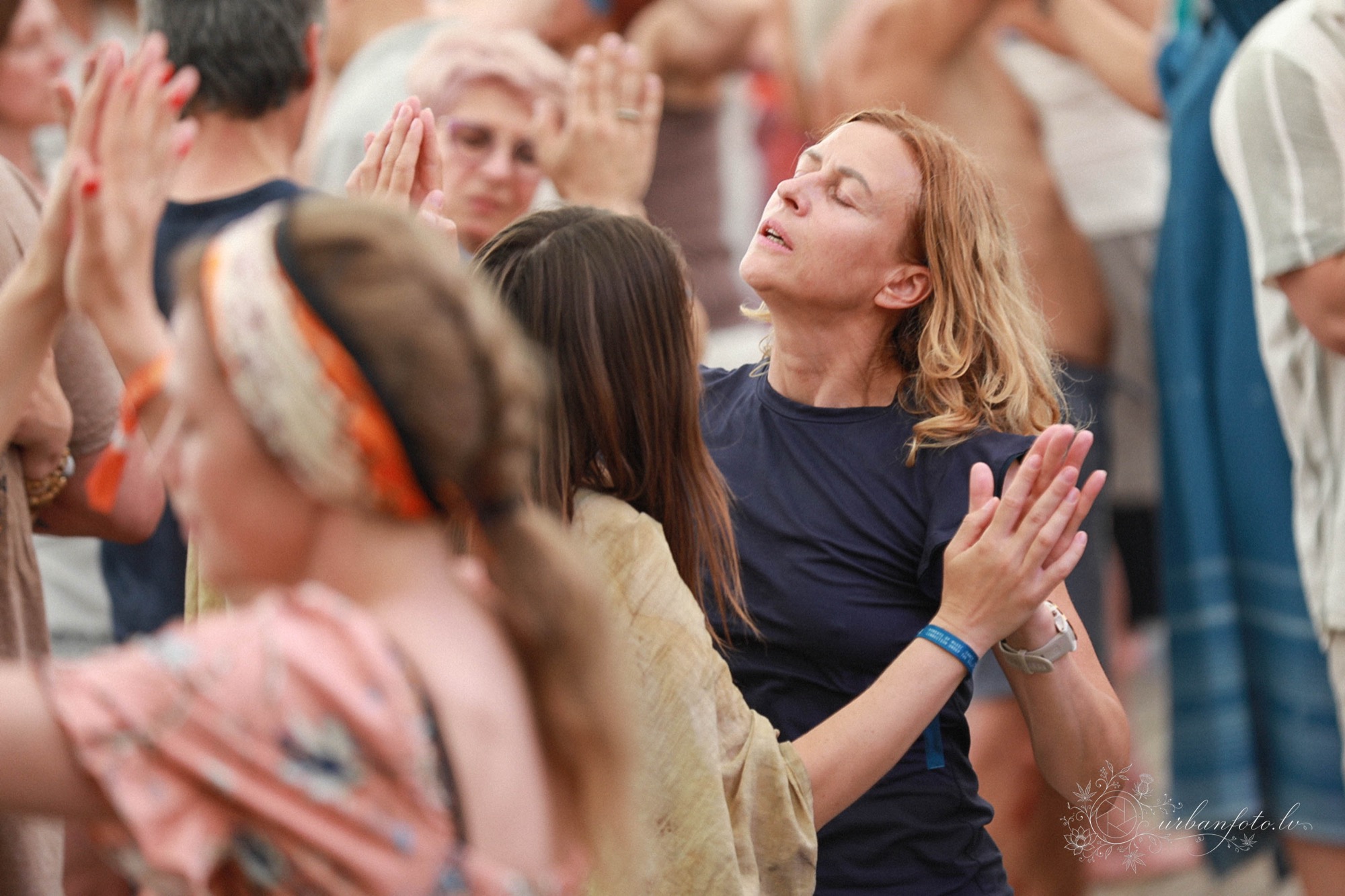 Festival-goer with eyes closed, immersed in the music at BŪTĪBA Festival 2026