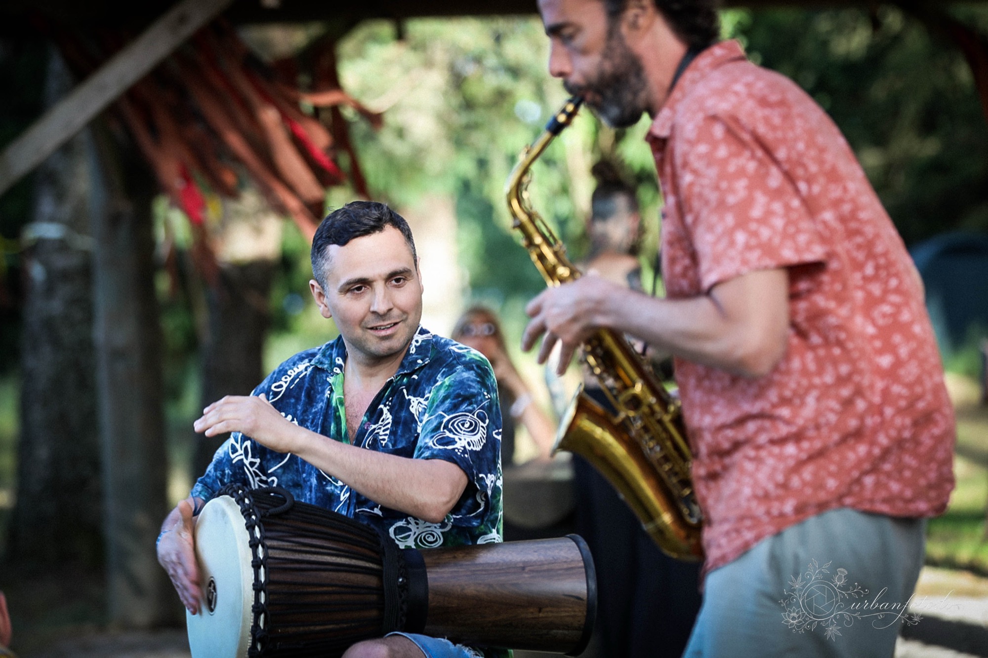 Pascal de Lacaze enjoying playing sax on nature with Būtība festival participants